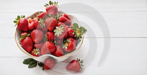 Fresh Strawberries in a White Bowl on Marble Background, Copy Space