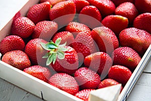 Fresh strawberries in a wooden box