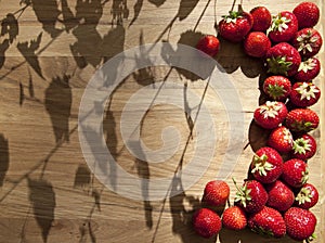 Fresh strawberries on wooden table