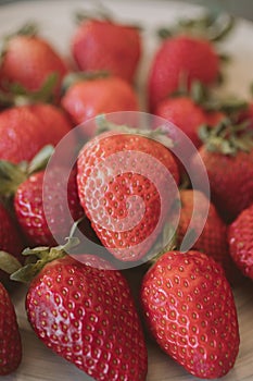 Fresh strawberry background. Close up view of red ripe strawberries.