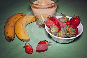 Fresh Strawberry and banana milkshake on the table.