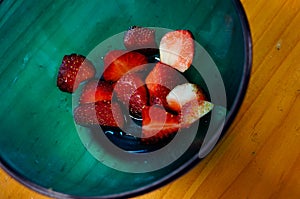 Fresh strawberry in blue bowl ready for meal