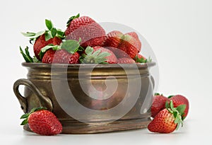 Fresh strawberry in brassy tub