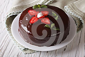 Fresh strawberry cake with chocolate topping horizontal close-up