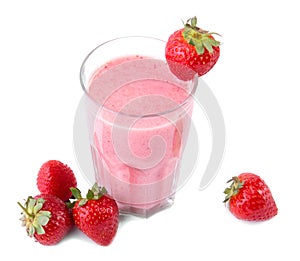 Fresh strawberry cocktail in a glass and a lot of red strawberries around isolated on white background. Fresh smoothie, top view.