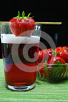 Fresh strawberry drink, radler fruit beer with white foam head