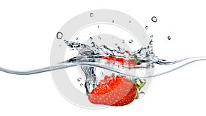 Fresh strawberry dropped into blue water with splash