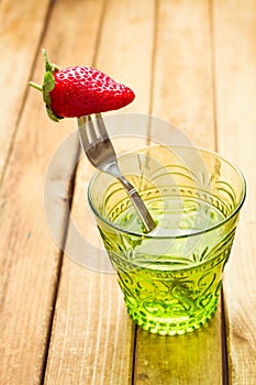 Fresh strawberry on fork