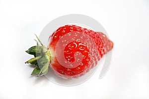 Fresh strawberry isolated on the white plate.