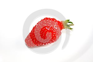 Fresh strawberry isolated on the white plate.