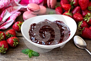Fresh strawberry jam in a white bowl