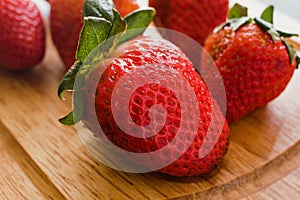 Fresh strawberry juicy on wooden table on a kitchen photo