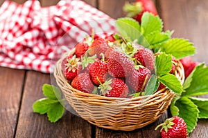 Fresh strawberry with leaves in basket