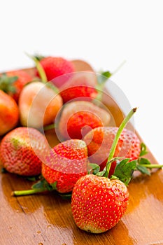 Fresh strawberry Pharachatan 80, wooden dish