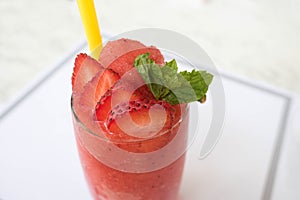 Fresh strawberry shake smoothies on white table background