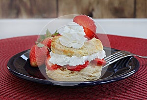 Fresh strawberry shortcake with homemade biscuits and garnished