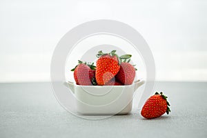 Fresh strawberry in square bowl