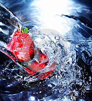 Fresh strawberry in water photo