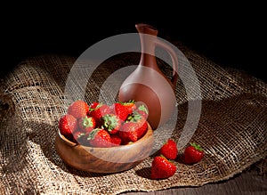 Fresh strawberry in wooden bowl