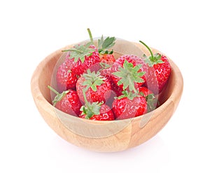 Fresh strawberry in a wooden bowl isolated on white background