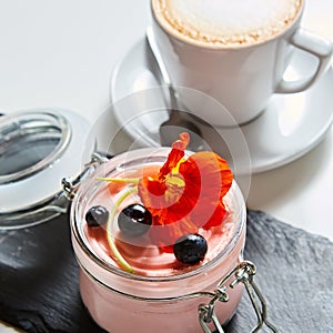 Fresh strawberry yoghurt dessert in glass, selective focus