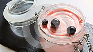 Fresh strawberry yoghurt dessert in glass, selective focus