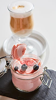 Fresh strawberry yoghurt dessert in glass, selective focus.