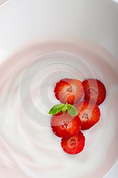 Fresh strawberry yoghurt with fresh berries close up