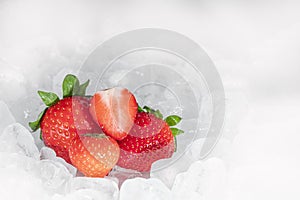 Fresh strawberrys in ice cubes background with copy space. Healthy 2020.