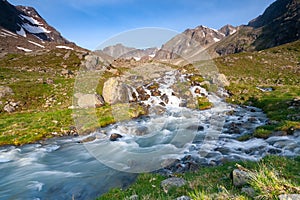 Fresh stream in river coming from glaciers up the valley near Neue Regensburger huette, Stubai Tyrol Alps, Austria