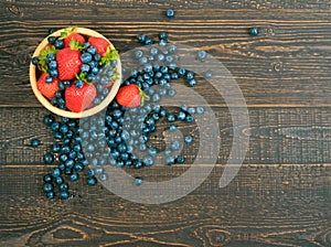 Fresh Summer Berries on Rustic Wooden Background