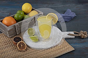 Fresh summer cocktail with lemon, selective focus image. Lemonade. Drink with fresh lemons. Lemon cocktail with juice