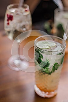 Fresh summer cocktails with bubbles, lime, mint and red berries