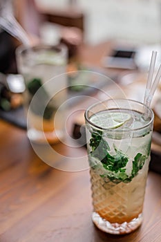 Fresh summer cocktails with bubbles, lime, mint and red berries