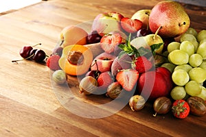 Fresh summer fruits with apple, grapes, berries, plums and healthy apricot