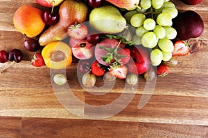 Fresh summer fruits with apple, grapes, berries, plums and healthy apricot