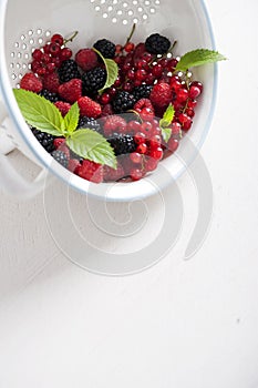 Fresh summer fruits in a colander