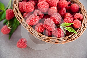 Fresh summer raspberry in a basket. Selective focus.