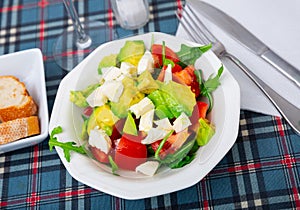 Fresh summer salad with vegetables and cheese