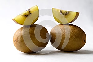 Fresh sungold kiwi fruit on white background