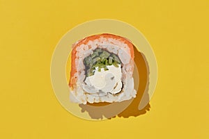 Fresh sushi roll philadelphia on yellow background