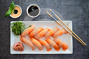 Fresh Sushi Roll with salmon.Japanese food. Copyspace black background