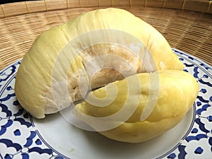 Fresh and sweet Durian on blue and white plase in bamboo basket photo