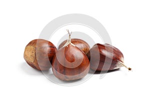 Fresh sweet edible chestnuts on white background