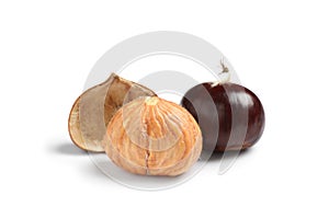 Fresh sweet edible chestnuts on white background