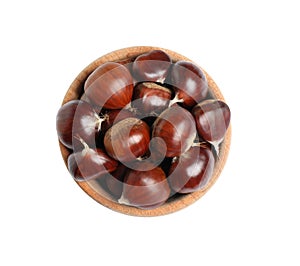 Fresh sweet edible chestnuts in wooden bowl on white background, top view