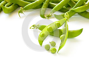 Fresh Sweet Green Pea Pods and Ceeds Isolated on White Background