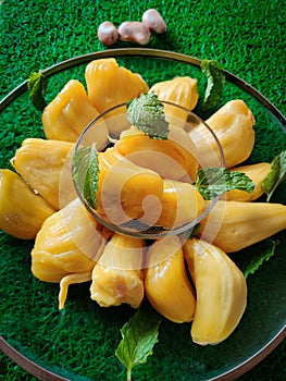 Fresh sweet jackfruit slices on a glass plate