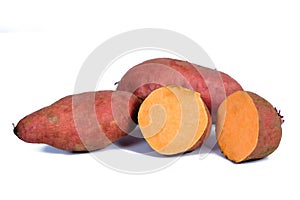 Fresh Sweet potato tubers on background