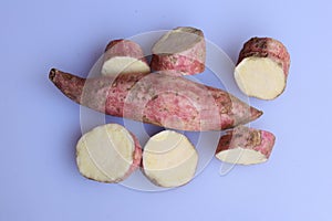 Fresh sweet potatoes isolated on white background